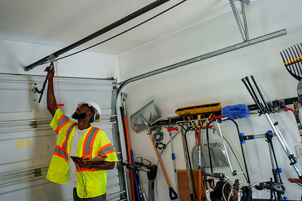 Professional Garage Door Panel Replacement technician working in Phoenix, NY